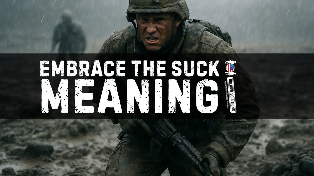 Soldier crawling through mud in heavy rain with determined expression, illustrating the meaning of embrace the suck in military life for Soldier Solutions blog.