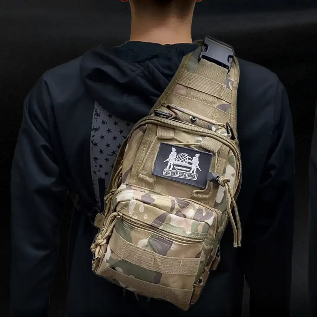 Soldier Solutions tactical sling bag worn on shoulder with visible multicam design and logo patch