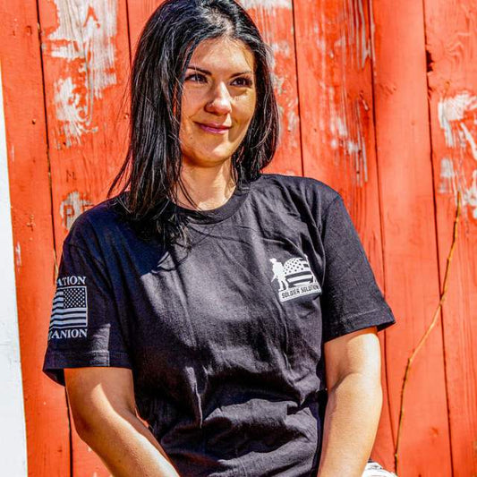Front view of women’s tee with Soldier Solutions chest print and patriotic sleeves