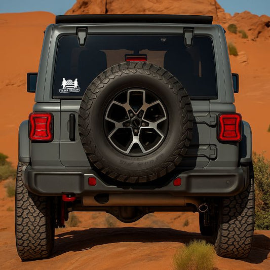 Soldier Solutions patriotic vinyl decal on Jeep rear window above spare tire