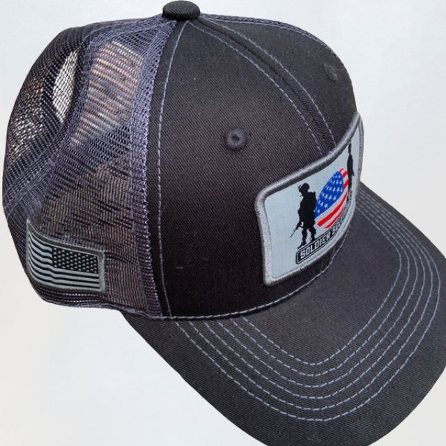 Side view of Soldier Solutions tactical mesh hat with American flag side patch and logo front patch