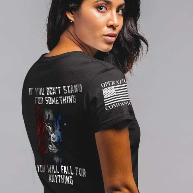Woman wearing Stand for Something shirt featuring patriotic lion and bold quote on back