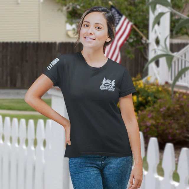 Woman in black Stand for Something shirt with Soldier Solutions Operation Companion logo on chest