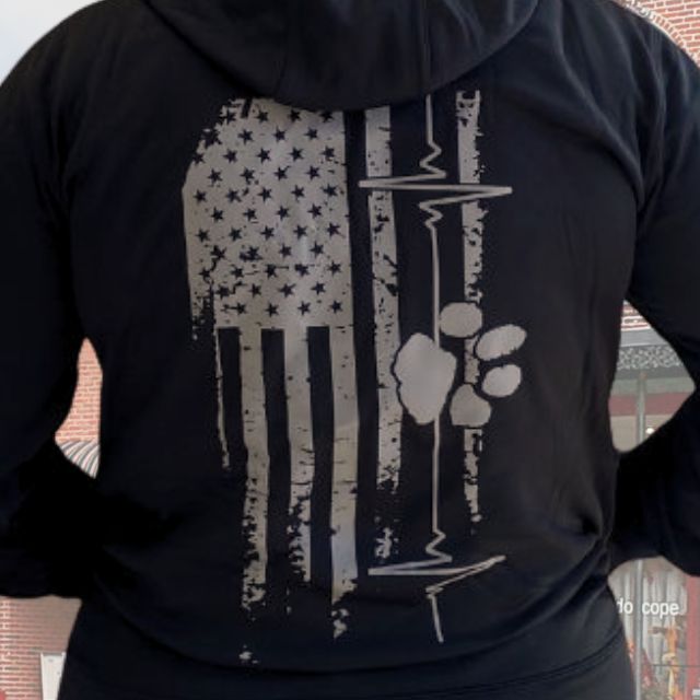 Close-up of heart line and paw print graphic on Women's American Companion patriotic hoodie