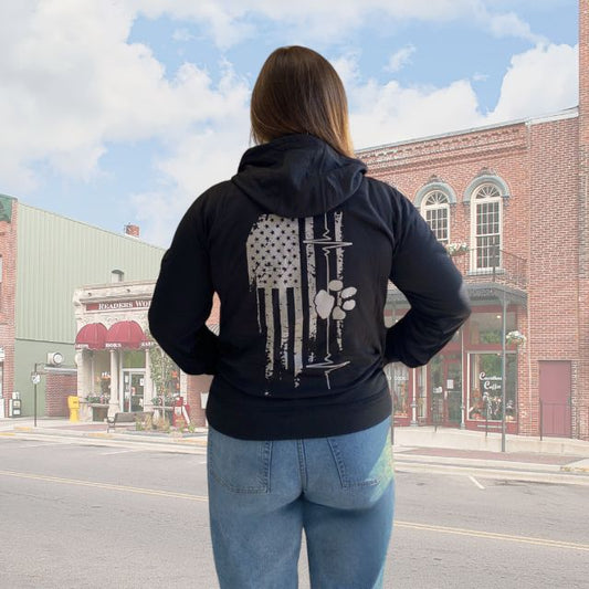 Women's American Companion hoodie with distressed American flag, heart line, and paw print graphic on back