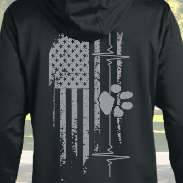 Close-up of distressed American flag and paw print design on men’s black American Companion Hoodie
