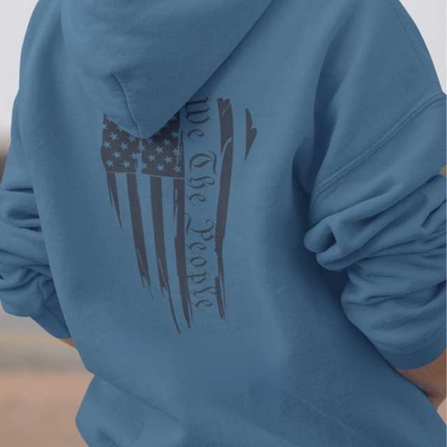 Close-up of American flag and “We The People” print on hoodie