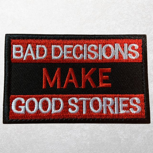 Red and black MOLLE patch with bold embroidered quote "Bad Decisions Make Good Stories"