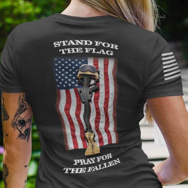 Detailed view of "Stand for the Flag, Pray for the Fallen" graphic with American flag and military battlefield cross