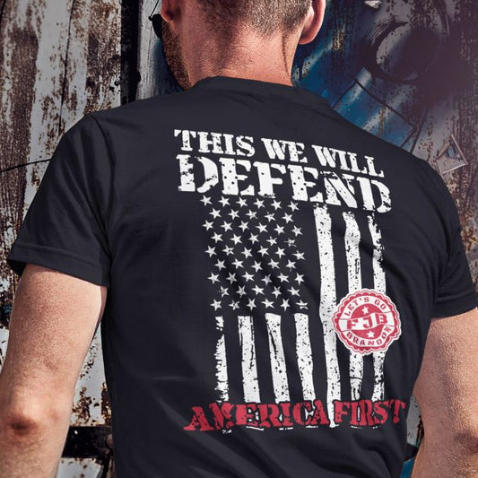 Men's patriotic t-shirt with distressed American flag and “This We Will Defend” design in white and red