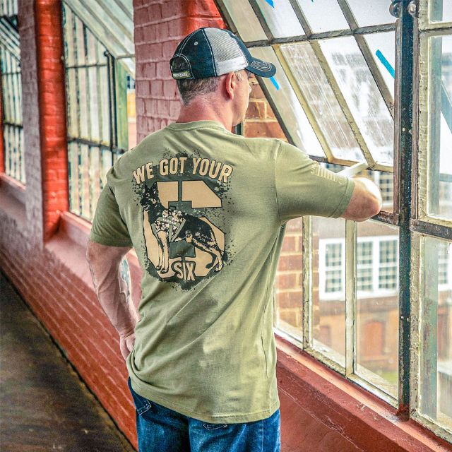 Man wearing We Got Your Six t-shirt featuring TADSAW service dog and bold number 6 graphic