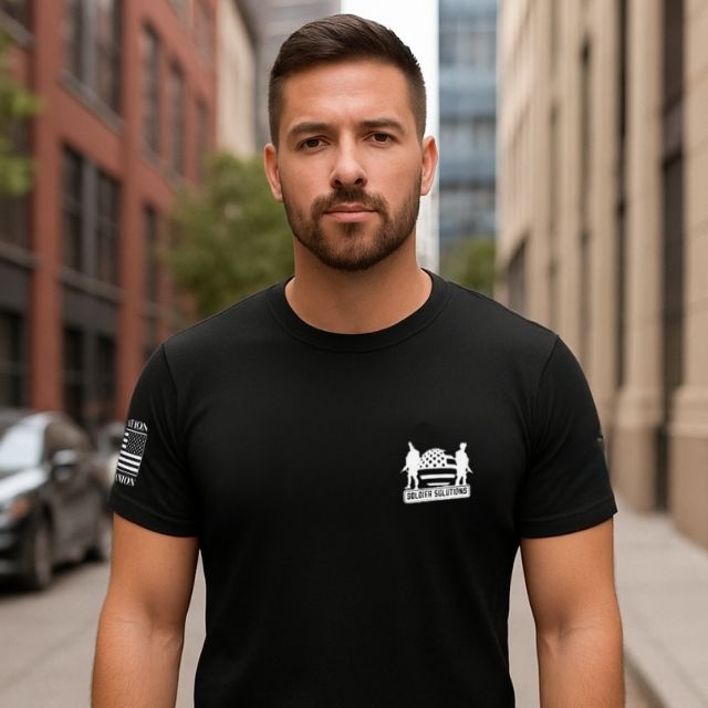 Front view of men’s patriotic t-shirt with Soldier Solutions logo supporting service animals.