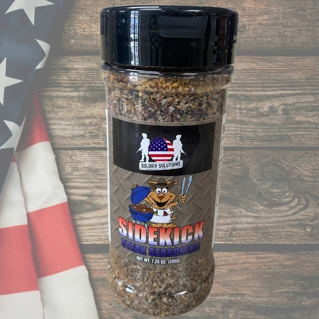 Front label of Sidekick Steak Seasoning bottle by Soldier Solutions featuring grill master mascot and patriotic branding