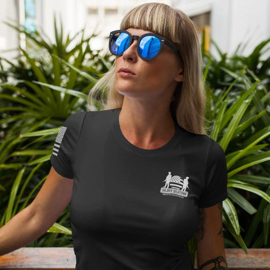 Woman wearing Soldier Solutions shirt with logo on chest and American flag on sleeve