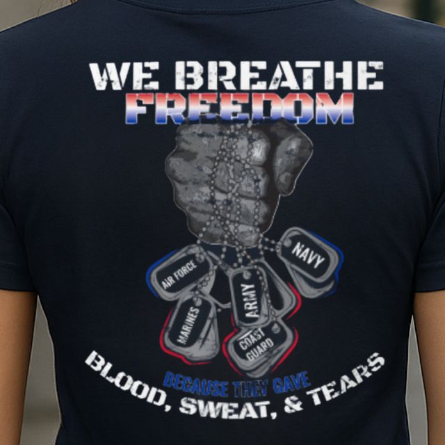 Close-up of We Breathe Freedom women’s patriotic t-shirt back graphic with raised fist and dog tags