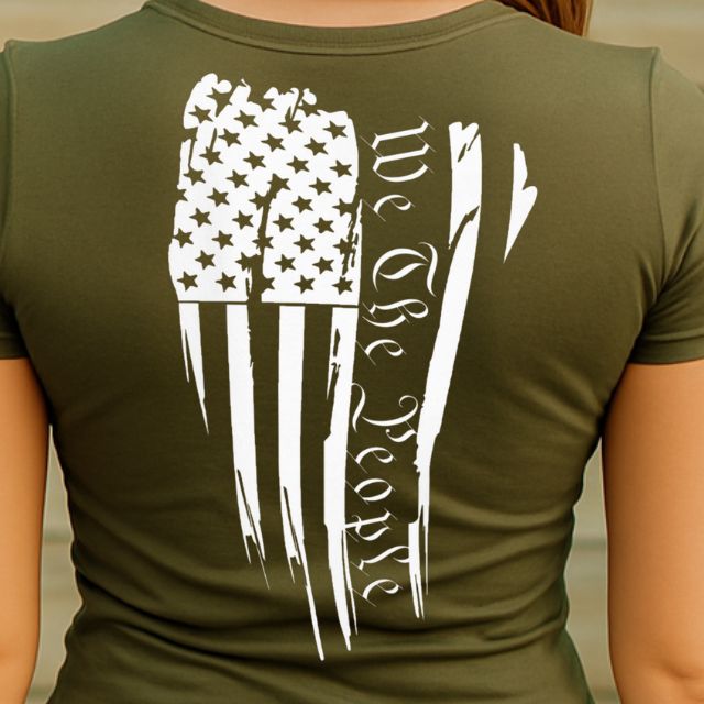 Close-up of We The People script and distressed flag on back of women's shirt