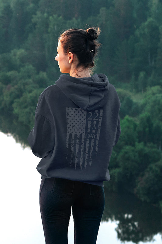 Back of women’s 22 A Day patriotic hoodie featuring distressed American flag and veteran suicide awareness message.