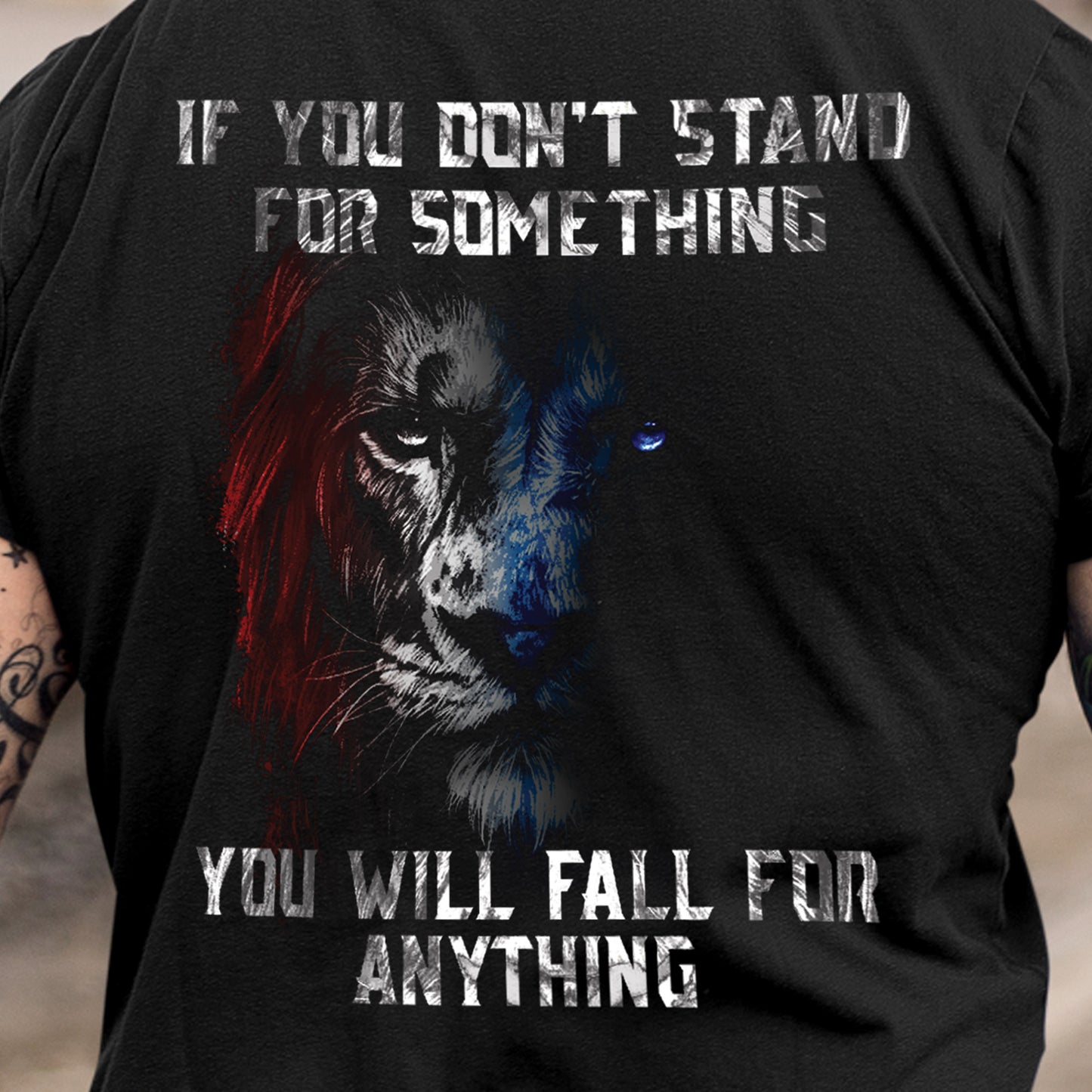 Close-up of distressed lion art and bold quote on the back of men’s Stand for Something t-shirt.