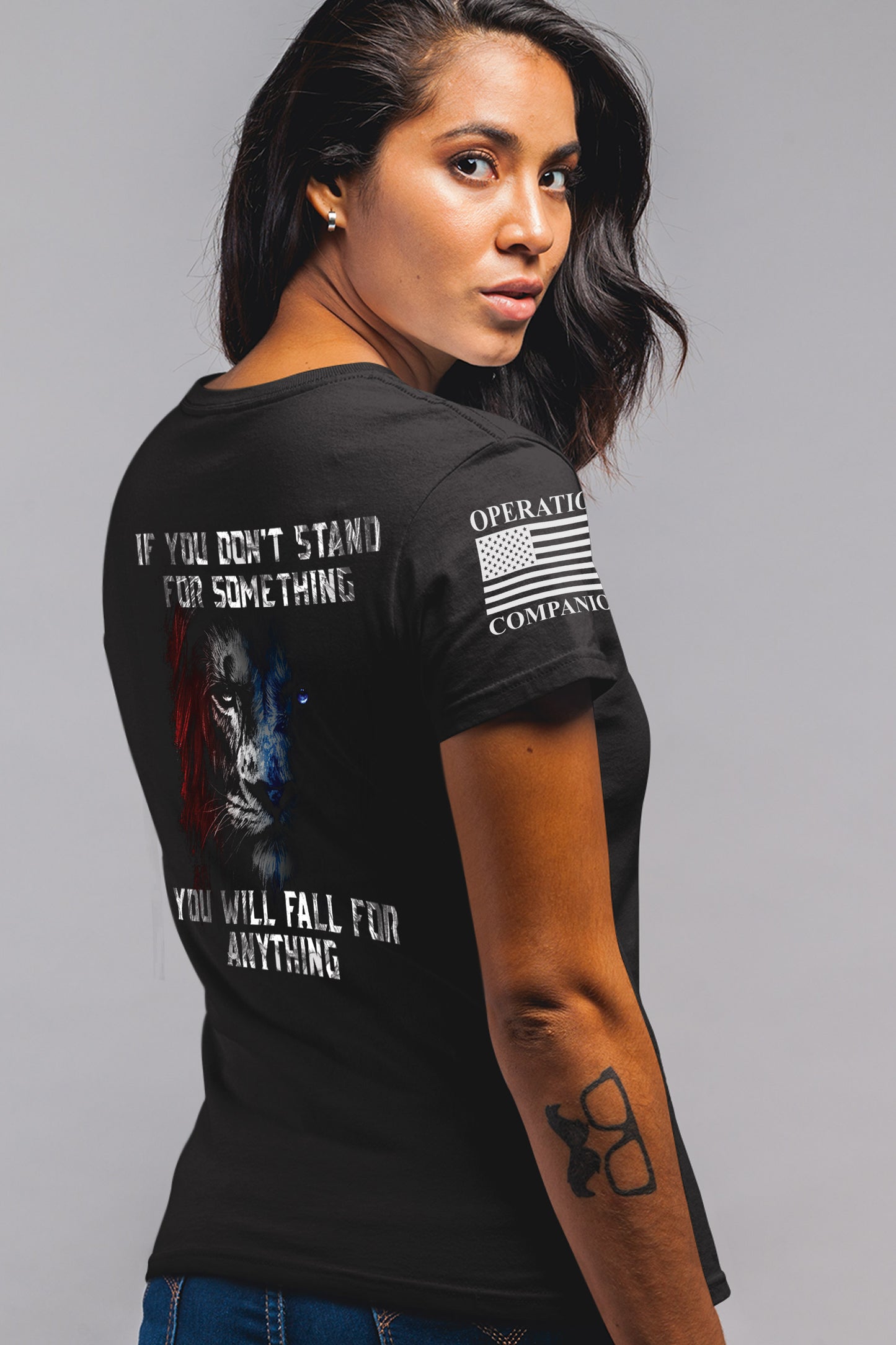 Back of women’s Stand for Something t-shirt featuring lion artwork with the quote ‘If you don’t stand for something, you will fall for anything.'