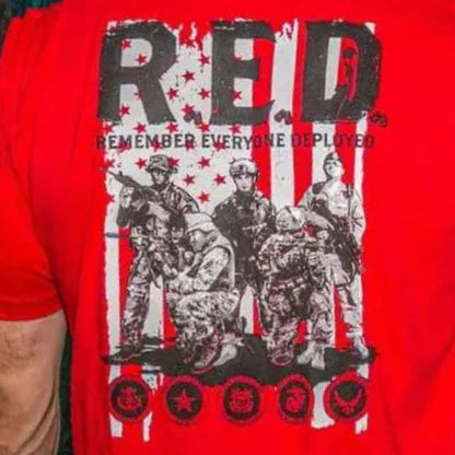 Close-up design on red R.E.D. shirt featuring deployed soldier imagery and armed service branch logos