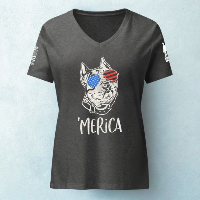 Flat lay of women’s Merica tee with American flag dog graphic and patriotic slogan