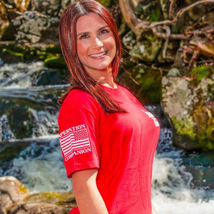 Front view of red Women's R.E.D. tee with Operation Companion sleeve and logo