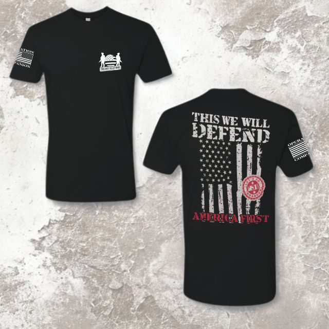 Full view of black men’s shirt with “This We Will Defend” and America First design by Soldier Solutions