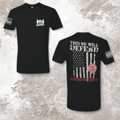 Full view of black men’s shirt with “This We Will Defend” and America First design by Soldier Solutions