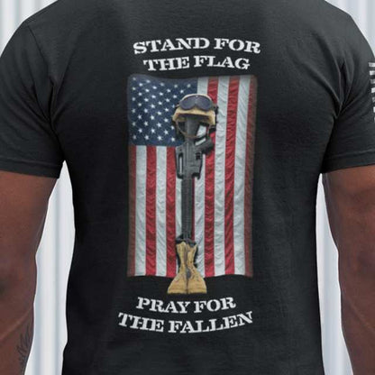 Close-up of battlefield cross graphic with American flag and patriotic message on men's t-shirt
