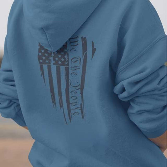 Close-up of American flag and “We The People” print on hoodie