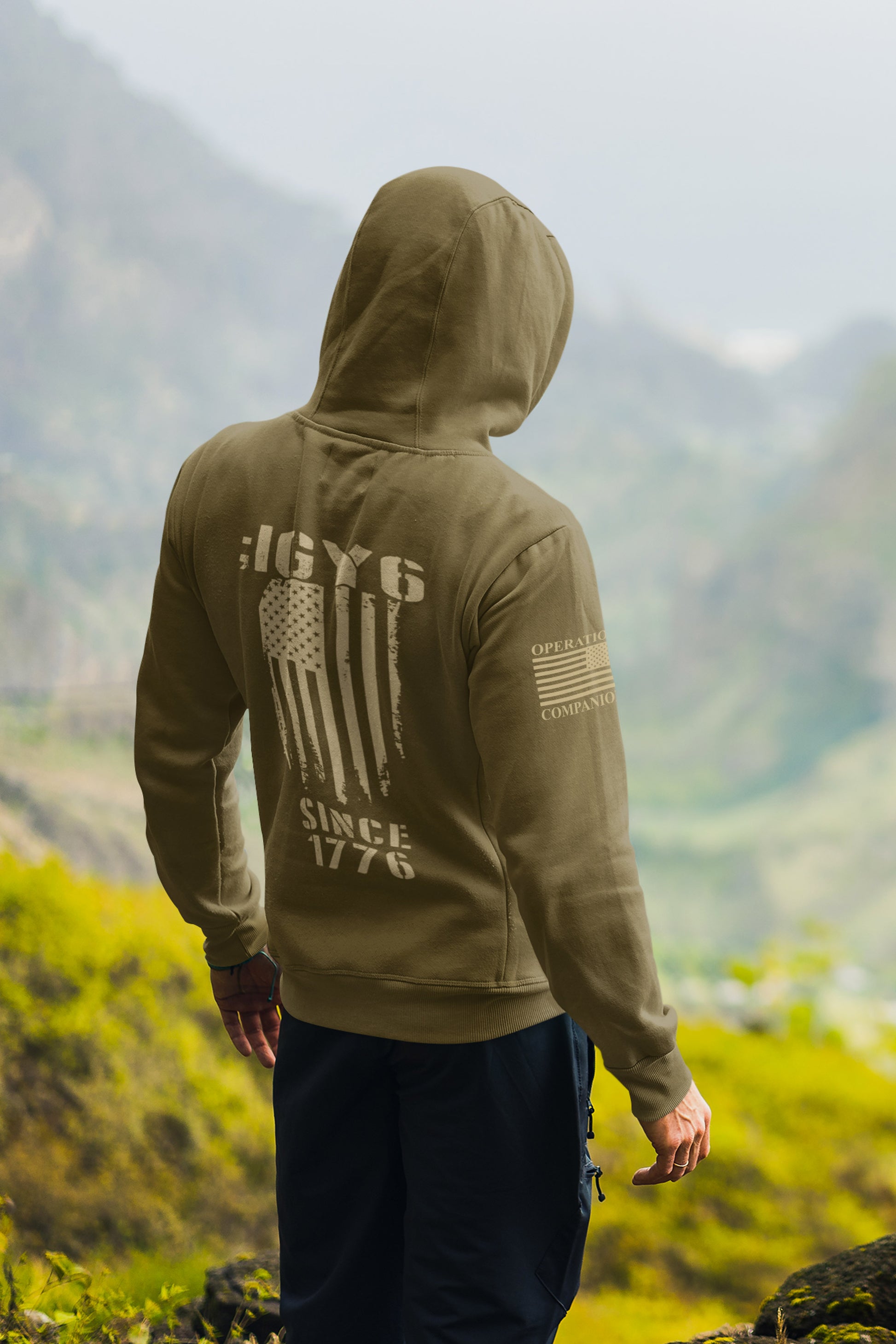 Patriotic IGY6 hoodie for men showing distressed flag and Since 1776 print with American flag patch on sleeve.