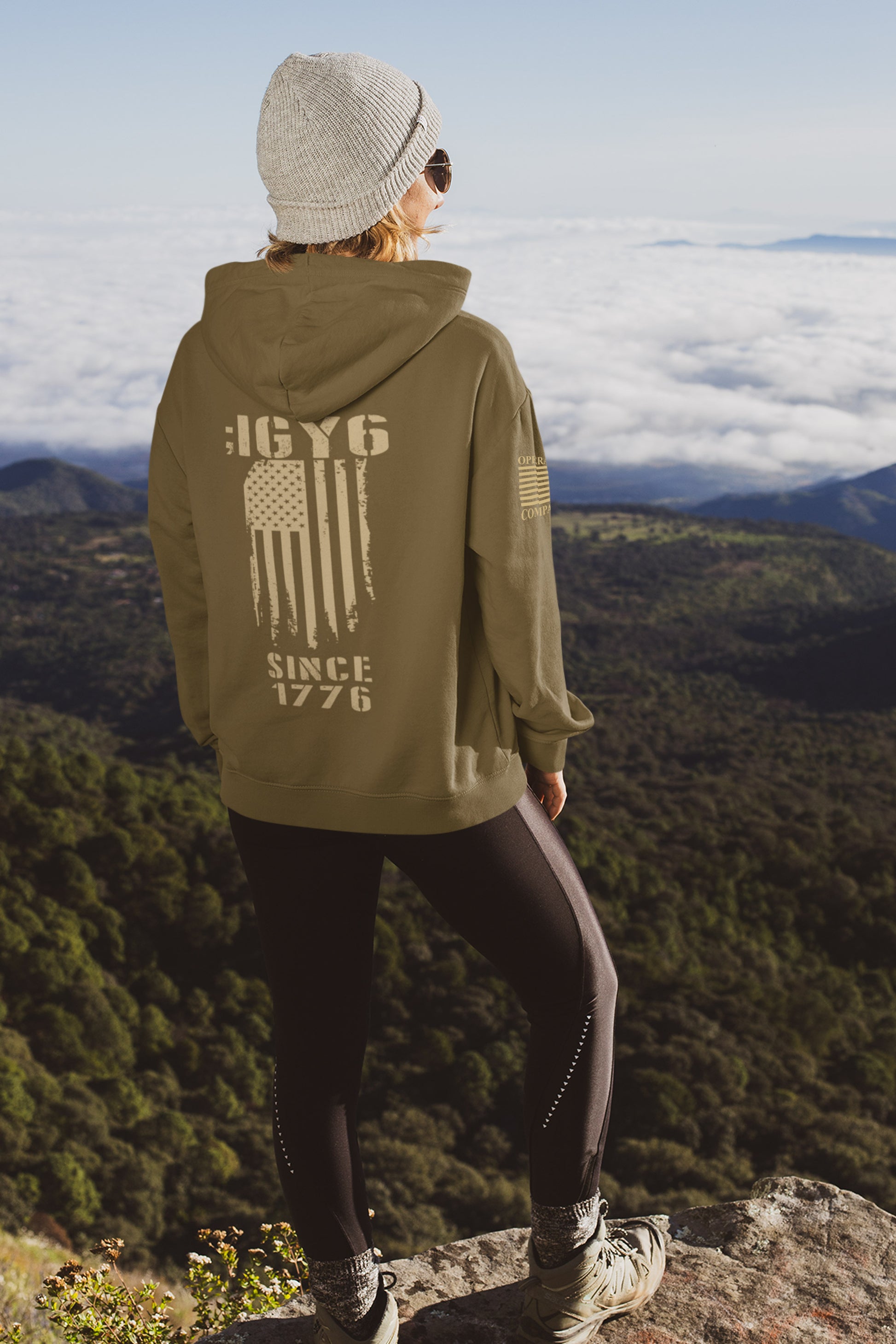 Back of IGY6 hoodie for women showing vertical American flag design, Since 1776 text, and sleeve flag detail.