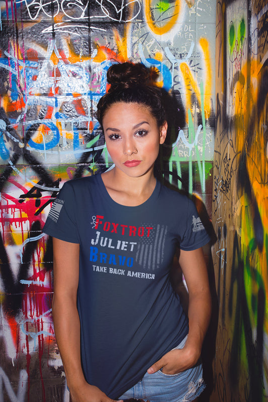 Foxtrot Juliet Bravo women’s shirt with bold red white and blue lettering and distressed flag overlay.