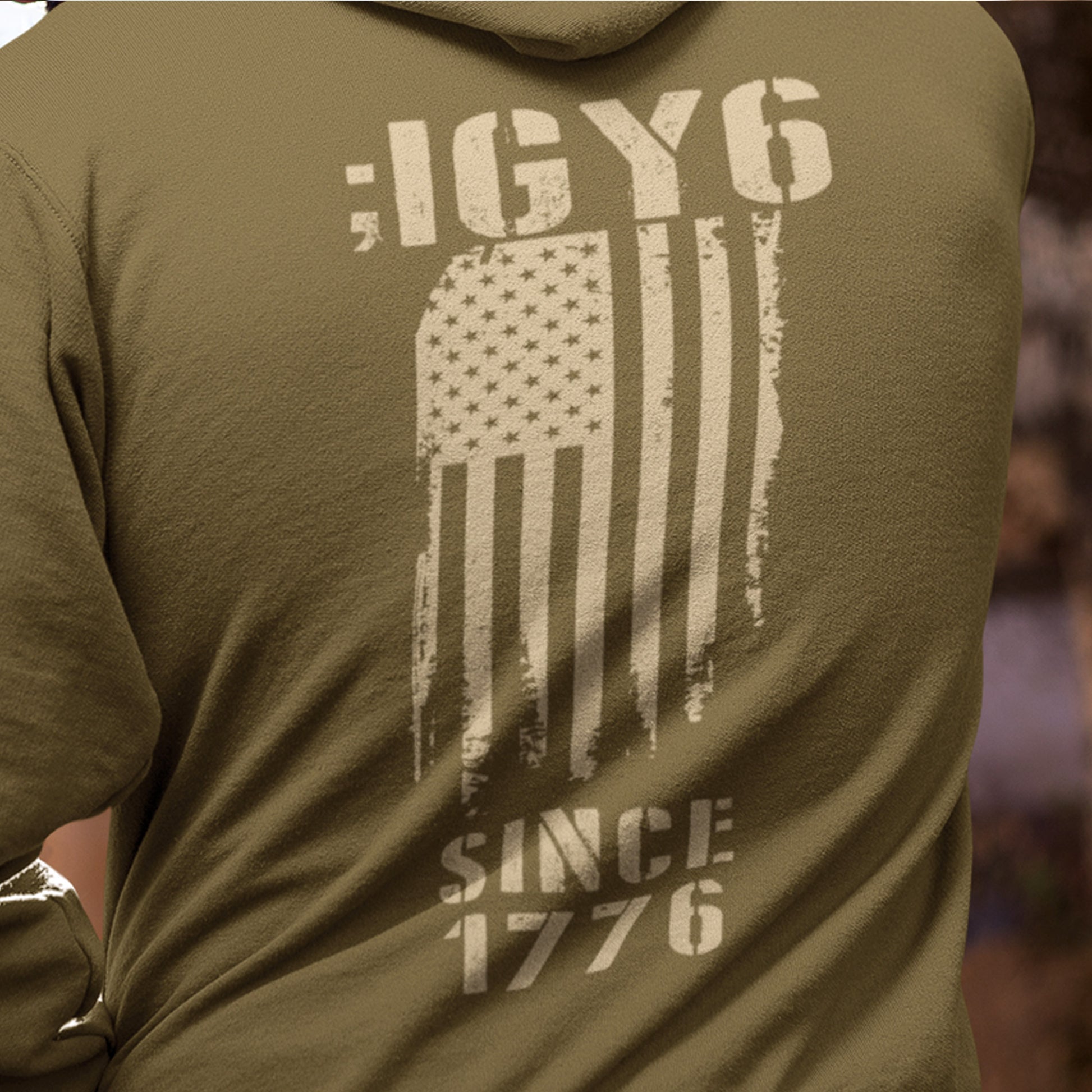 Back of IGY6 men’s hoodie with vertical distressed American flag and Since 1776 print with sleeve detail.