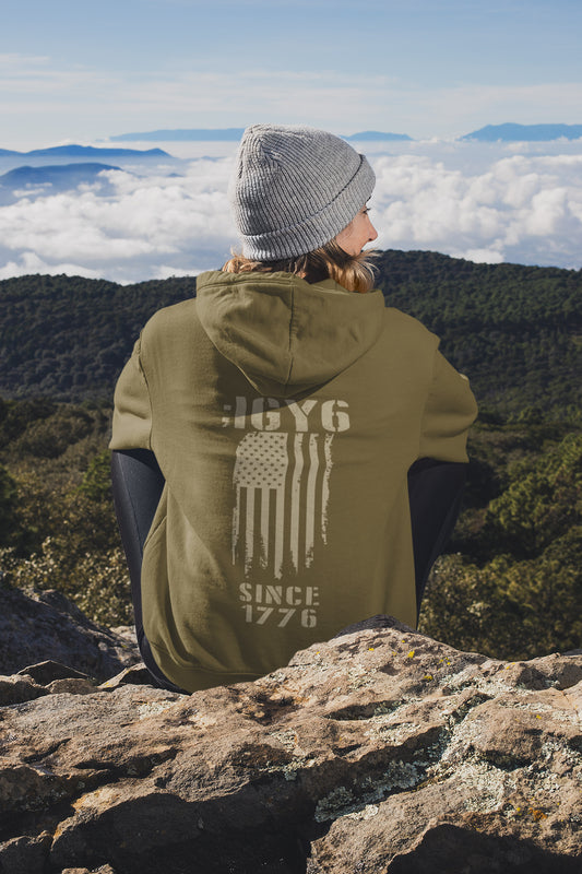 IGY6 Since 1776 women’s hoodie featuring distressed American flag and bold patriotic back print with sleeve insignia.