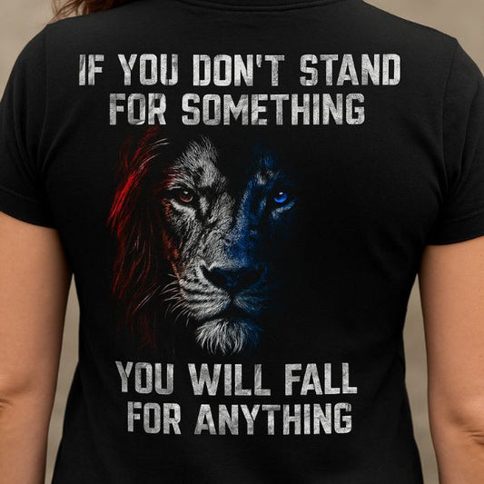 Close-up of lion graphic and quote on Stand for Something shirt with distressed patriotic colors and bold lettering.
