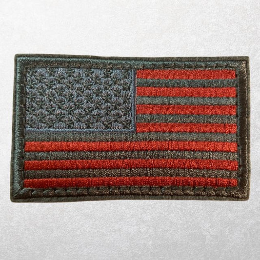 Tactical subdued red American flag patch with MOLLE hook-and-loop attachment