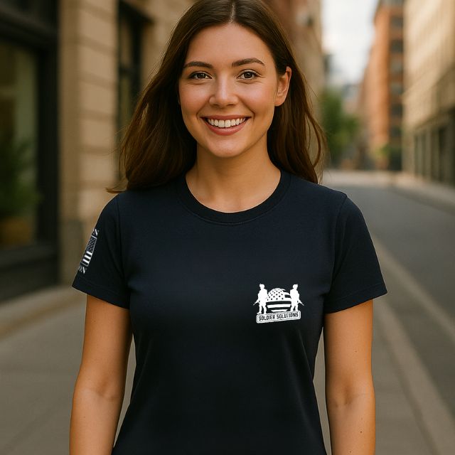 Woman wearing We Breathe Freedom women’s patriotic t-shirt front view with Soldier Solutions logo