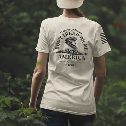 Back of Don’t Tread on Me women’s shirt featuring coiled rattlesnake, Liberty or Death message, and 1776 graphic.